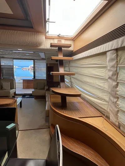 Amia Yacht Photos Pics Interior of 2006 Ferretti Yachts 731 with modern wooden staircase and large windows.