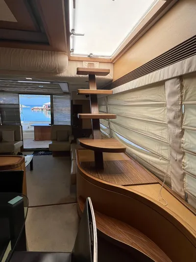 Amia Yacht Photos Pics Interior of 2006 Ferretti Yachts 731 with modern wooden staircase and ocean view.