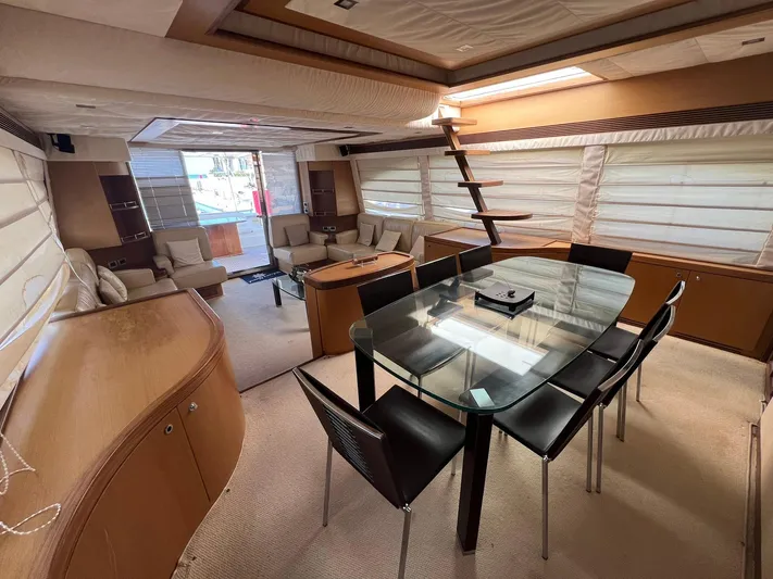 Amia Yacht Photos Pics Luxurious interior of a 2006 Ferretti Yachts 731 with modern dining and seating areas.