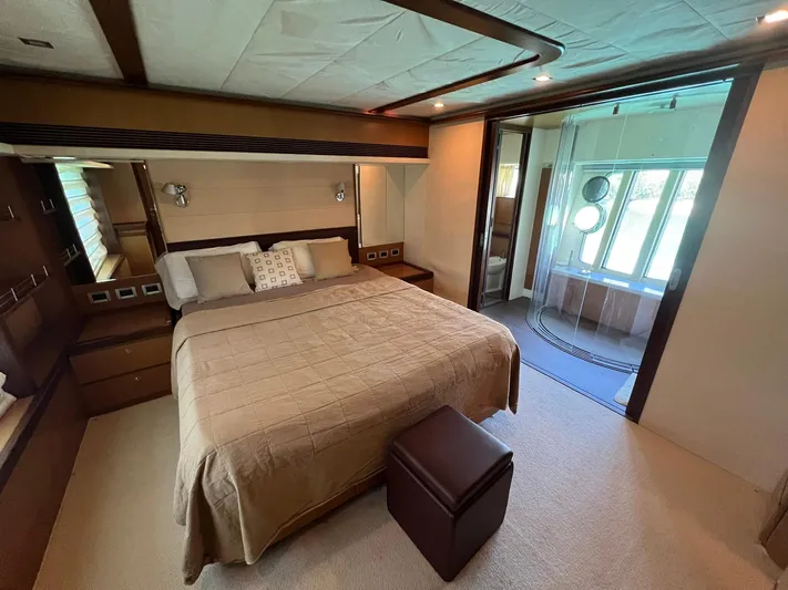 Amia Yacht Photos Pics Luxurious bedroom on a 2006 Ferretti Yachts 731 with ensuite bathroom.