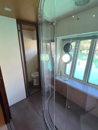 Amia Yacht Photos Pics 2006 Ferretti Yachts 731 bathroom with modern fixtures and large windows.