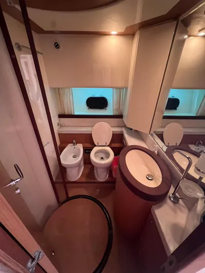 Amia Yacht Photos Pics 2006 Ferretti Yachts 731 bathroom with modern fixtures and ample lighting.