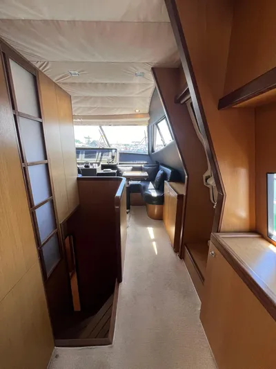 Amia Yacht Photos Pics Interior of 2006 Ferretti Yachts 731, featuring modern wood finishes and spacious layout.