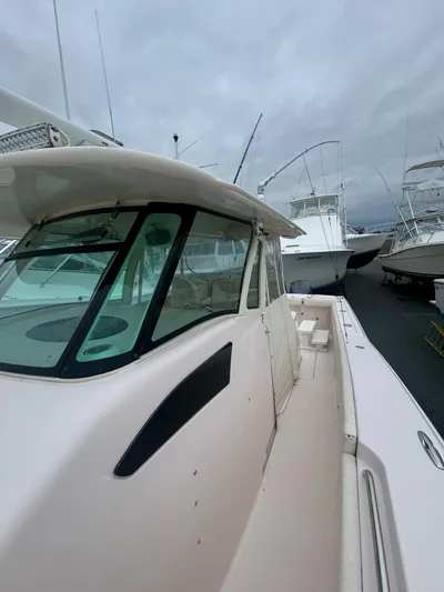  Yacht Photos Pics 2014 Grady-White Canyon 376 boat docked, showcasing sleek design and spacious deck.