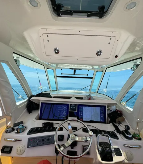  Yacht Photos Pics Helm of 2014 Grady-White Canyon 376 boat with dual screens and ocean view.