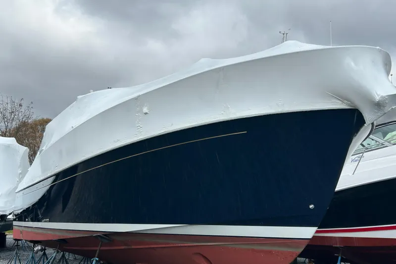 Esc Key Yacht Photos Pics 2023 Back Cove 39O boat covered in protective wrap, easily boarded with zipper door.