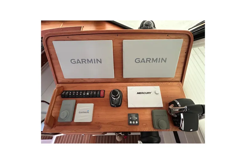 Esc Key Yacht Photos Pics 2023 Back Cove 39O helm with Garmin and Mercury controls, featuring dual screens, Flir night vision, bow thruster and joystick.