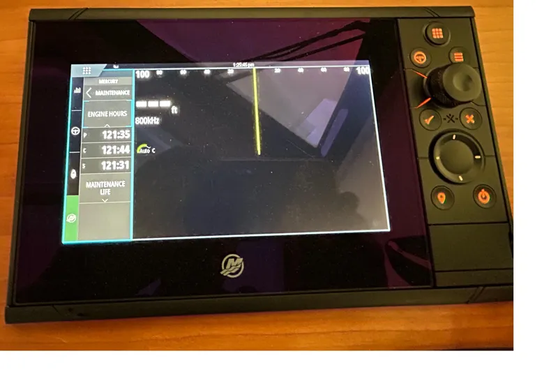 Esc Key Yacht Photos Pics Display screen of a 2023 Back Cove 39O boat showing engine hours and maintenance data.