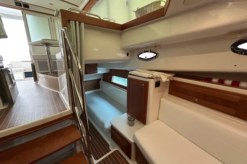 Esc Key Yacht Photos Pics Interior of 2023 Back Cove 39O yacht, featuring cozy seating and elegant wood finishes.