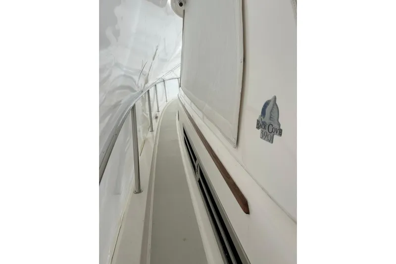 Esc Key Yacht Photos Pics Side view of 2023 Back Cove 39O yacht, showcasing sleek design and logo.