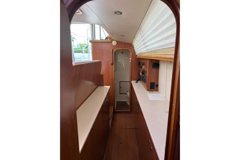 Sirenia Yacht Photos Pics Interior of 2014 Gemini Legacy 35 sailboat with wood finish and modern amenities.