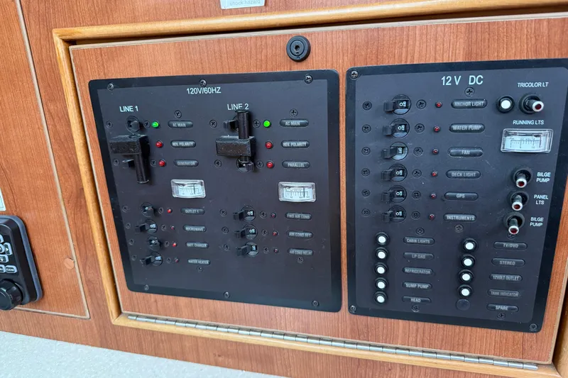 Sirenia Yacht Photos Pics Electrical control panel on a 2014 Gemini Legacy 35 boat, featuring switches and indicators.
