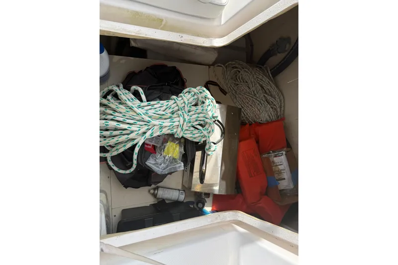 Sirenia Yacht Photos Pics Storage compartment of a 2014 Gemini Legacy 35 boat with ropes and safety gear.