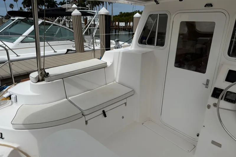 Sirenia Yacht Photos Pics Interior view of 2014 Gemini Legacy 35 sailboat cockpit with seating and helm.