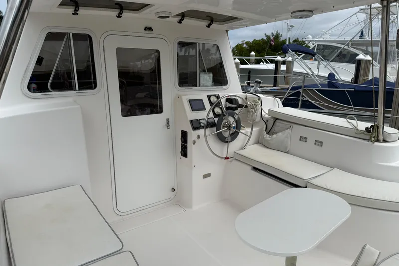 Sirenia Yacht Photos Pics Cockpit of 2014 Gemini Legacy 35 catamaran with steering wheel and seating area.