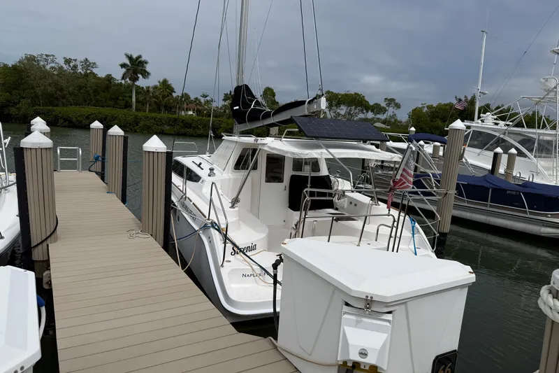 Sirenia Yacht Photos Pics 2014 Gemini Legacy 35 catamaran docked at marina with solar panel and American flag.