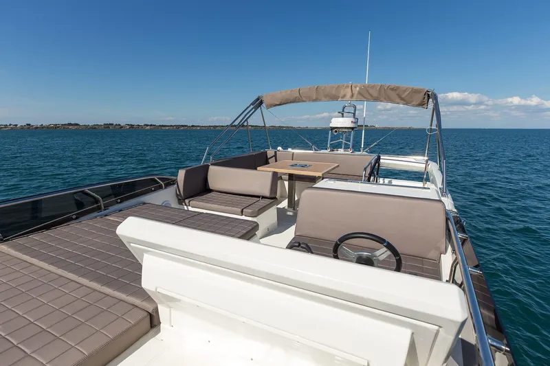 Aura Yacht Photos Pics 2018 Prestige 520 yacht with spacious deck and seating on open water.