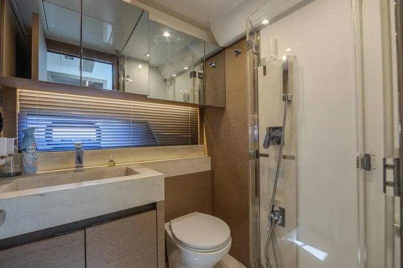 Aura Yacht Photos Pics Luxurious bathroom in a 2018 Prestige 520 yacht with modern fixtures and elegant design.