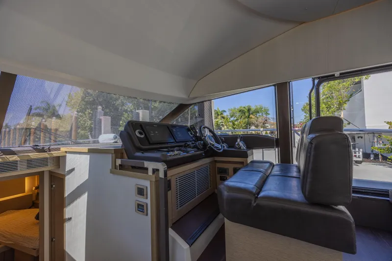 Aura Yacht Photos Pics Interior helm of 2018 Prestige 520 yacht with modern navigation equipment.