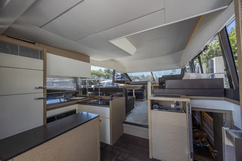 Aura Yacht Photos Pics Interior of 2018 Prestige 520 yacht, featuring modern kitchen and seating area.