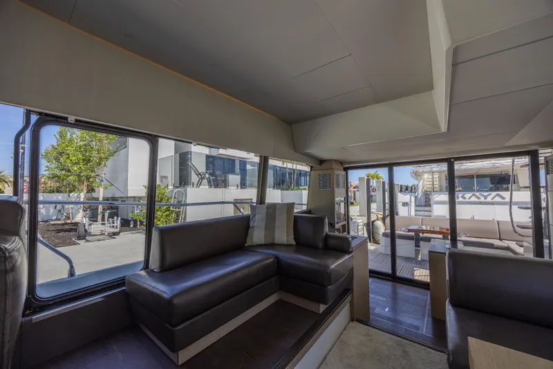 Aura Yacht Photos Pics Interior of 2018 Prestige 520 yacht with modern seating and large windows.