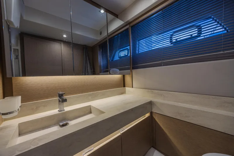 Aura Yacht Photos Pics Luxurious bathroom interior of 2018 Prestige 520 yacht with modern fixtures and sleek design.
