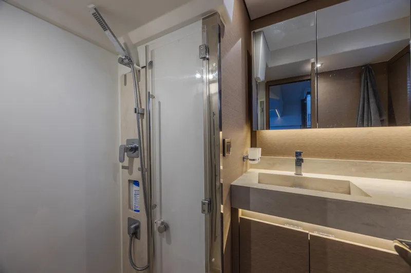 Aura Yacht Photos Pics Luxurious bathroom in 2018 Prestige 520 yacht with modern shower and sleek vanity.
