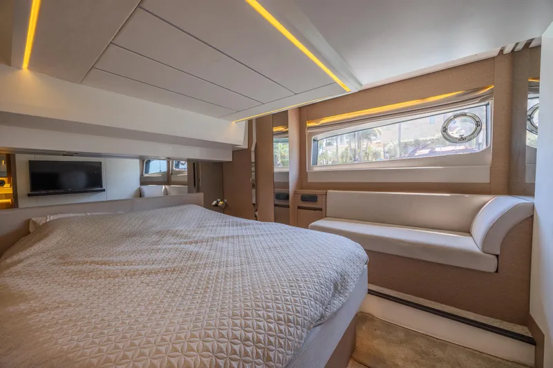 Aura Yacht Photos Pics Luxurious interior of a 2018 Prestige 520 yacht with a cozy bedroom and modern design.