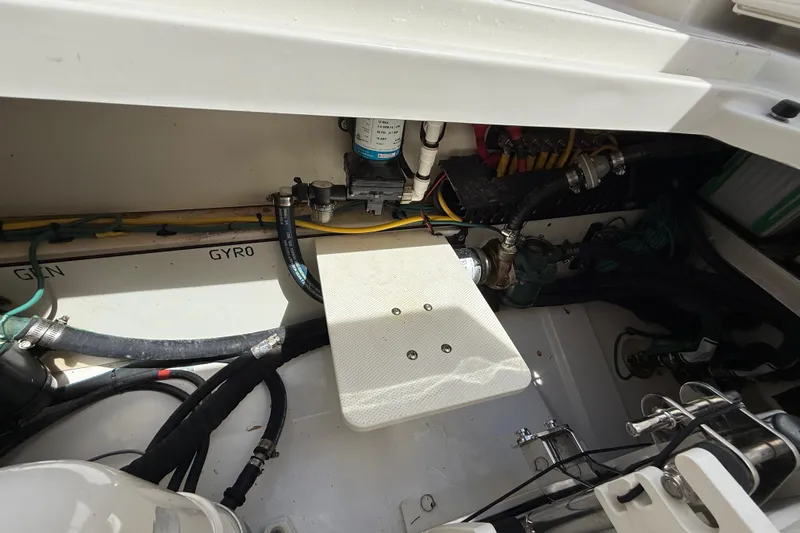  Yacht Photos Pics Engine compartment of a 2022 Pursuit S 358 Sport boat, showing hoses and components.