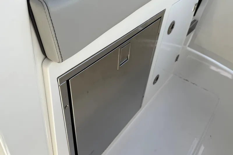  Yacht Photos Pics 2022 Pursuit S 358 Sport boat interior detail with stainless steel compartment.