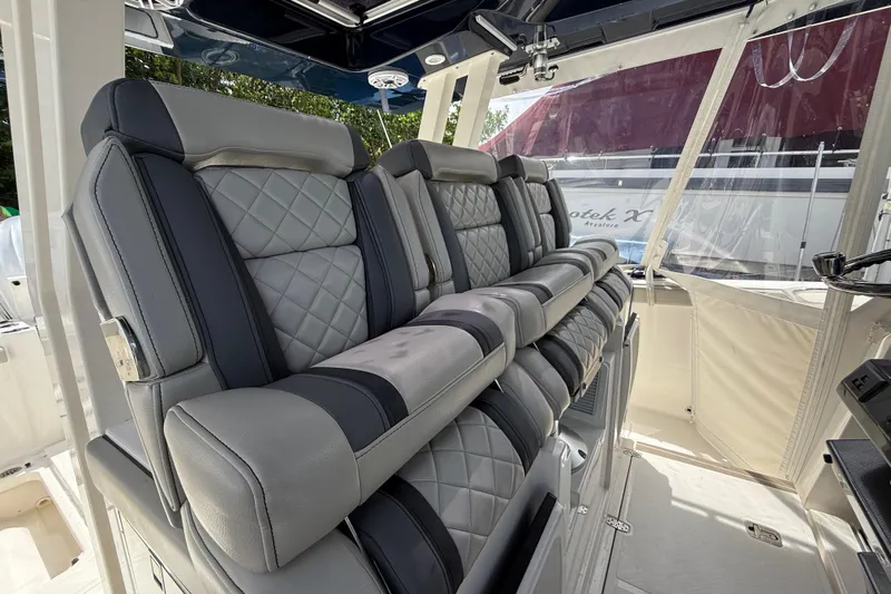 Yacht Photos Pics Luxurious seating on 2022 Pursuit S 358 Sport boat, featuring quilted upholstery and modern design.