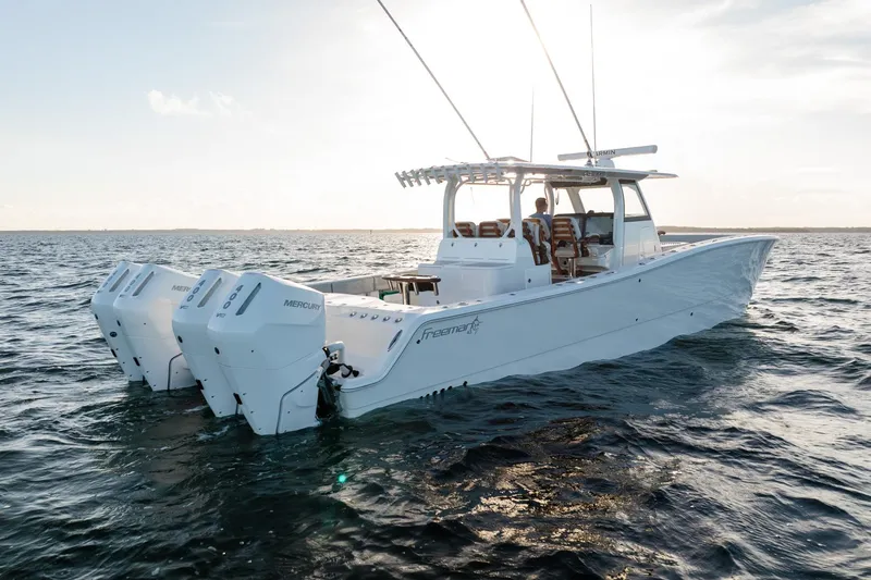  Yacht Photos Pics 2023 Freeman 43 boat on open water, featuring powerful Mercury engines.