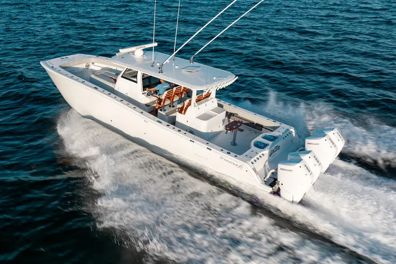  Yacht Photos Pics 2023 Freeman 43 boat cruising on open water with twin Mercury engines.