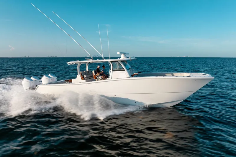  Yacht Photos Pics 2023 Freeman 43 boat cruising on open water under clear blue sky.