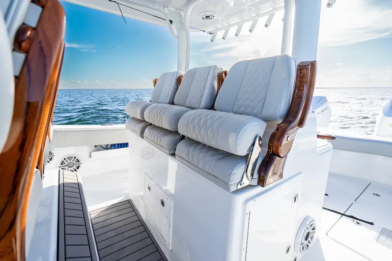  Yacht Photos Pics Luxurious seating on a 2023 Freeman 43 boat, with ocean view and elegant design.