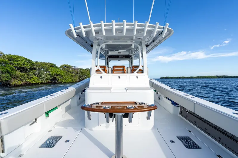 Yacht Photos Pics 2023 Freeman 43 boat interior with sleek design, on calm blue water under clear sky.