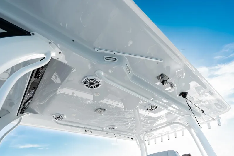  Yacht Photos Pics 2023 Freeman 43 boat roof with speakers and equipment against blue sky.