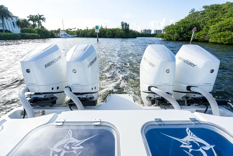  Yacht Photos Pics Four Mercury Verado outboard engines on a 2023 Freeman 43 boat, cruising through a scenic waterway.