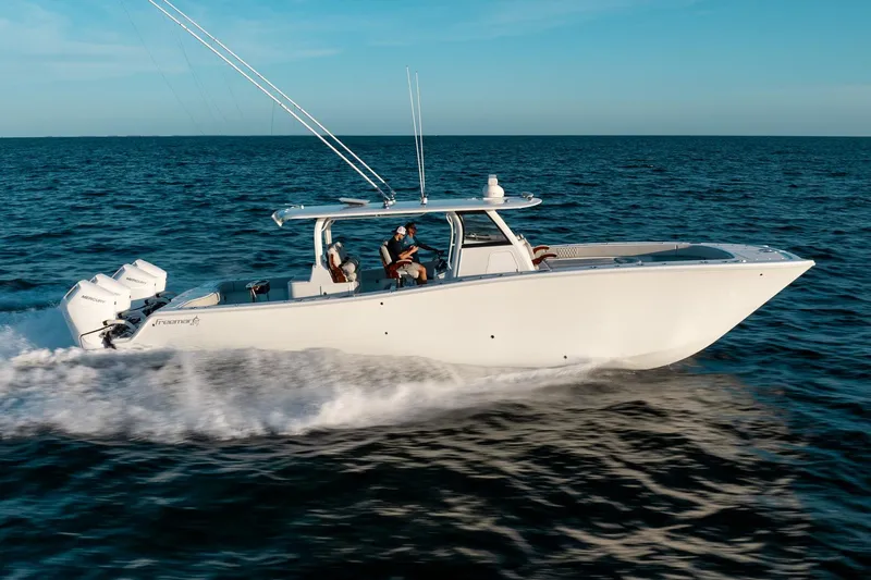  Yacht Photos Pics 2023 Freeman 43 boat cruising on open water under clear blue sky.