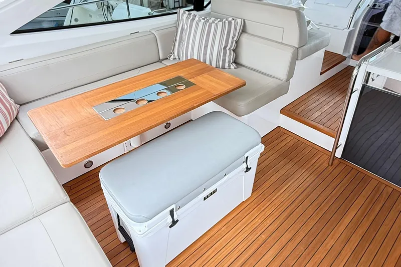 2024 Fairline Targa 50 Open @ Cancun Yacht Photos Pics Luxurious interior of 2024 Fairline Targa 50 Open yacht with wooden table and seating.