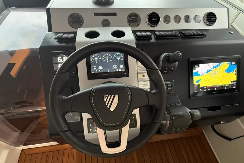 2024 Fairline Targa 50 Open @ Cancun Yacht Photos Pics 2024 Fairline Targa 50 Open yacht dashboard with steering wheel and navigation displays.