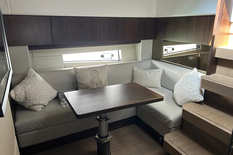 2024 Fairline Targa 50 Open @ Cancun Yacht Photos Pics 2024 Fairline Targa 50 Open interior with cozy seating and elegant wooden table.