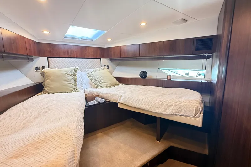 2024 Fairline Targa 50 Open @ Cancun Yacht Photos Pics Luxurious cabin interior of 2024 Fairline Targa 50 Open yacht with twin beds.