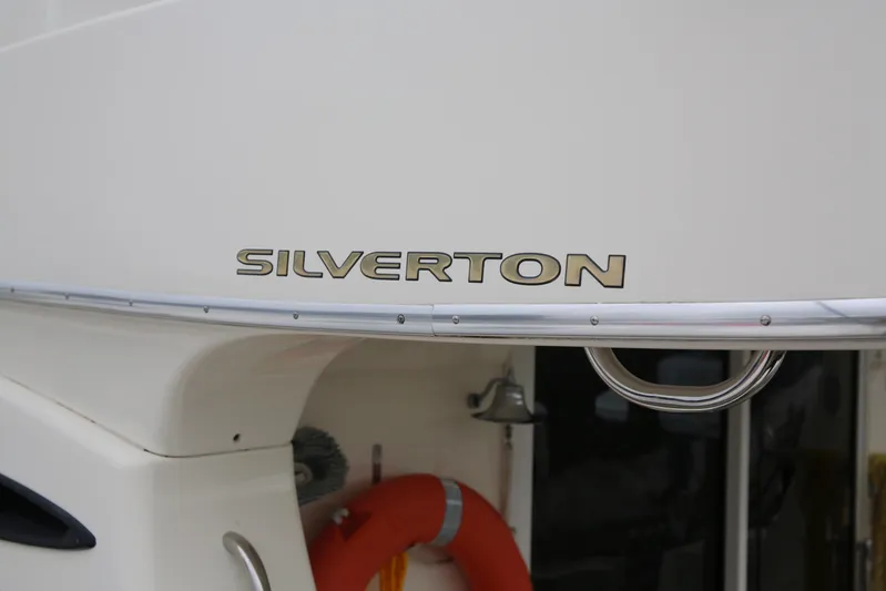  Yacht Photos Pics 2008 Silverton 38 Sport Bridge yacht with visible logo and safety equipment.