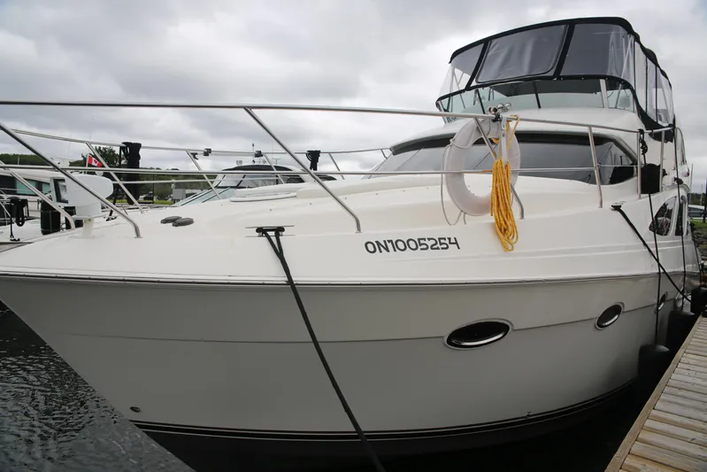  Yacht Photos Pics 2008 Silverton 38 Sport Bridge yacht docked, featuring sleek design and modern amenities.