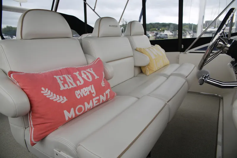  Yacht Photos Pics 2008 Silverton 38 Sport Bridge interior with plush seating and decorative pillows.