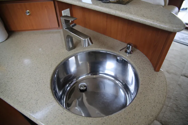  Yacht Photos Pics Modern sink and faucet in 2008 Silverton 38 Sport Bridge yacht interior.