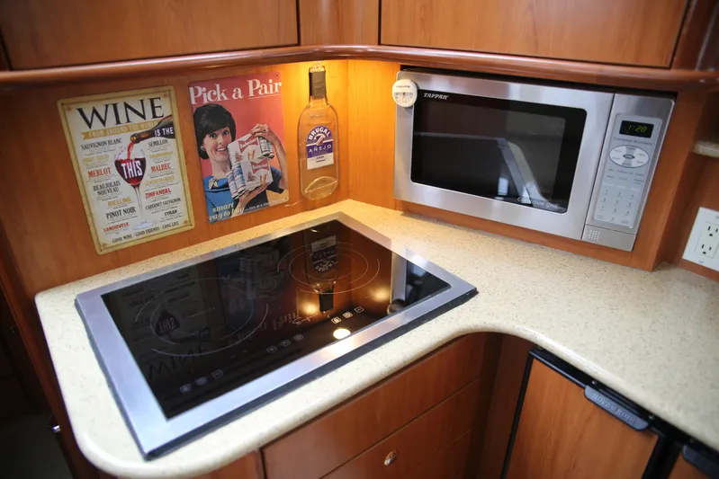  Yacht Photos Pics Kitchen area of 2008 Silverton 38 Sport Bridge with stove and microwave.