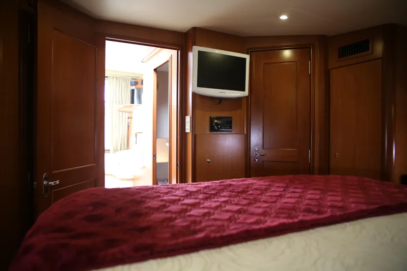  Yacht Photos Pics Luxurious interior of 2008 Silverton 38 Sport Bridge yacht with wood paneling and TV.