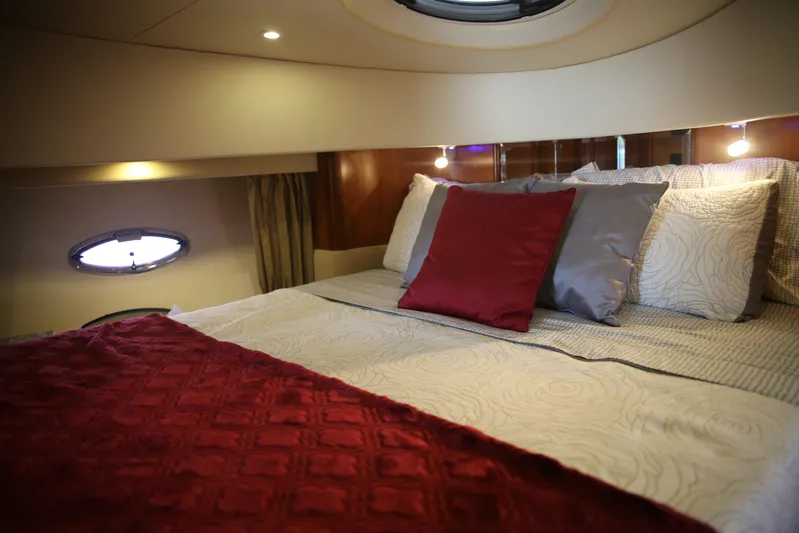  Yacht Photos Pics Luxurious cabin interior of 2008 Silverton 38 Sport Bridge yacht with elegant bedding.